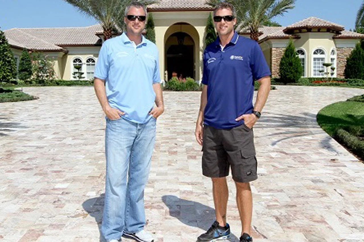 Todd and Scott Bird on a finished travertine driveway