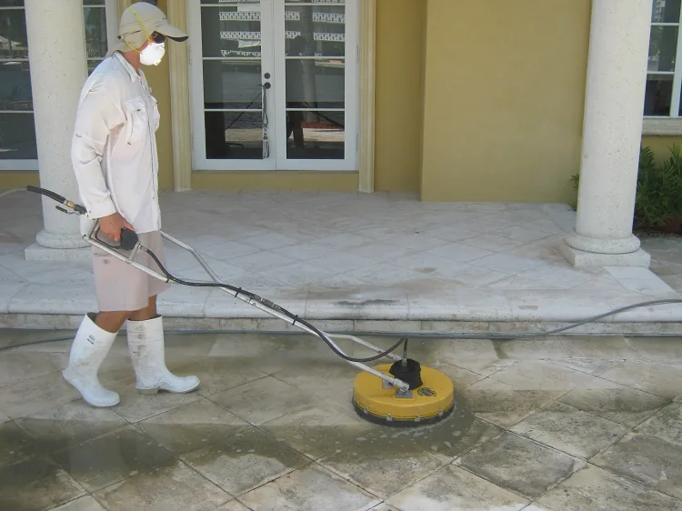 Crew pressure washing a deck
